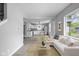Living room with hardwood floors and a comfortable sofa at 1472 N Grant Ave, Indianapolis, IN 46201