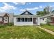 Charming house with a white picket fence at 1472 N Grant Ave, Indianapolis, IN 46201