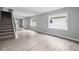 Open living area with hardwood floors and kitchen view at 1472 N Grant Ave, Indianapolis, IN 46201