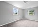 Simple bedroom with gray walls and carpet at 1472 N Grant Ave, Indianapolis, IN 46201