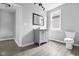 Updated bathroom with grey vanity and track lighting at 1472 N Grant Ave, Indianapolis, IN 46201