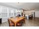 Bright dining area with wooden table and view of the kitchen at 750 Keck Way, Westfield, IN 46074