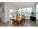 Charming dining room with wood table and access to backyard patio at 750 Keck Way, Westfield, IN 46074