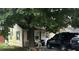Tan house side view with landscaping at 3816 St Charles St, Anderson, IN 46013