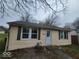 Tan house with new windows and front yard at 3816 St Charles St, Anderson, IN 46013