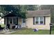 Tan house with front yard and landscaping at 3816 St Charles St, Anderson, IN 46013