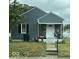Gray house with a covered porch and small yard at 3410 Forest Ter, Anderson, IN 46013