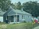 Gray house with a covered porch and small yard at 3410 Forest Ter, Anderson, IN 46013
