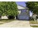 Two-story house with attached garage and landscaped yard at 2307 Blackthorn Dr, Franklin, IN 46131