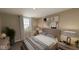 Cozy bedroom with wood-look flooring and neutral decor at 5736 Birtz Rd, Indianapolis, IN 46216