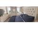 Main bedroom with plush upholstered headboard and large windows at 5736 Birtz Rd, Indianapolis, IN 46216