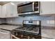 Stainless steel range and microwave in modern kitchen at 1131 S East St, Lebanon, IN 46052