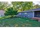 Spacious backyard with mature trees and a shed at 1131 S East St, Lebanon, IN 46052