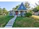A charming gray house with a red door and a well-manicured lawn at 1131 S East St, Lebanon, IN 46052
