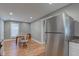 Light-filled dining area adjacent to kitchen with hardwood floors at 1131 S East St, Lebanon, IN 46052