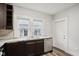 Kitchen with granite countertops and stainless steel dishwasher at 3005 Broadway St, Indianapolis, IN 46205