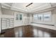 Formal dining area with built-in shelving, a window seat, and hardwood floors at 3005 Broadway St, Indianapolis, IN 46205