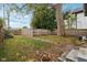 Large backyard with mature tree and wooden fence at 3005 Broadway St, Indianapolis, IN 46205