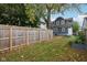 Private backyard with gray house and garden at 3005 Broadway St, Indianapolis, IN 46205