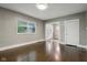 Living room with dark hardwood floors and an open floor plan at 3005 Broadway St, Indianapolis, IN 46205