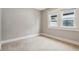 Bedroom with neutral carpeting and window at 3005 Broadway St, Indianapolis, IN 46205