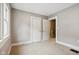 Bedroom with neutral carpeting and double closets at 3005 Broadway St, Indianapolis, IN 46205