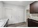 Kitchen with granite countertops and dark brown cabinets at 3005 Broadway St, Indianapolis, IN 46205