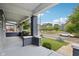 Inviting front porch with brick columns, hanging planters, and a view of the street at 3005 Broadway St, Indianapolis, IN 46205