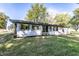 Ranch home with gray siding and mature landscaping at 13309 W Sr 32, Yorktown, IN 47396