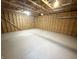 Unfinished garage interior with exposed rafters and concrete floor at 2068 S Avon Ave, Avon, IN 46123