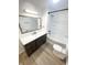 Elegant bathroom with dark vanity, white subway tile, and a bathtub at 2068 S Avon Ave, Avon, IN 46123