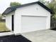 New detached garage with white vinyl siding and a concrete pad at 2068 S Avon Ave, Avon, IN 46123