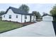 Charming home exterior with detached garage and landscaping at 2068 S Avon Ave, Avon, IN 46123