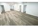 Spacious finished basement with hardwood flooring and multiple rooms at 2068 S Avon Ave, Avon, IN 46123