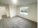 Well-lit bedroom with gray carpeting and a double-door closet at 2068 S Avon Ave, Avon, IN 46123
