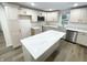 Modern kitchen with white cabinets, quartz countertops, and stainless steel appliances at 2068 S Avon Ave, Avon, IN 46123