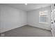 Simple bedroom with carpet flooring and a window with a view at 10620 Banyan Wood Ct, Indianapolis, IN 46239