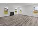 Large living room with hardwood floors and a fireplace at 10620 Banyan Wood Ct, Indianapolis, IN 46239