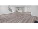 Open concept living room with hardwood floors and kitchen view at 10620 Banyan Wood Ct, Indianapolis, IN 46239
