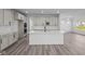 Spacious kitchen with island, stainless steel appliances, and light cabinets at 10620 Banyan Wood Ct, Indianapolis, IN 46239