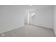 Spacious bedroom featuring a window with a view and grey carpeting at 10620 Banyan Wood Ct, Indianapolis, IN 46239