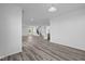 Bright and spacious living room with hardwood floors and a view of the staircase at 10620 Banyan Wood Ct, Indianapolis, IN 46239
