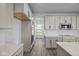 Modern kitchen with white cabinets, quartz countertops and stainless steel appliances at 10620 Banyan Wood Ct, Indianapolis, IN 46239