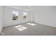 Spacious bedroom with two windows, grey carpet and door at 10620 Banyan Wood Ct, Indianapolis, IN 46239