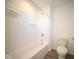 Clean bathroom with white tub and shower at 7888 Magnolia St, New Palestine, IN 46163