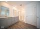 Modern bathroom with gray double vanity and shower at 7888 Magnolia St, New Palestine, IN 46163