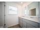 Modern bathroom with double vanity and grey cabinets at 7888 Magnolia St, New Palestine, IN 46163