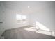 Well-lit bedroom featuring grey carpet and a window at 7888 Magnolia St, New Palestine, IN 46163