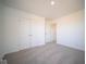 Spacious bedroom with double doors and carpeting at 7888 Magnolia St, New Palestine, IN 46163