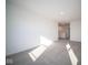 Spacious bedroom with gray carpet and loft access at 7888 Magnolia St, New Palestine, IN 46163